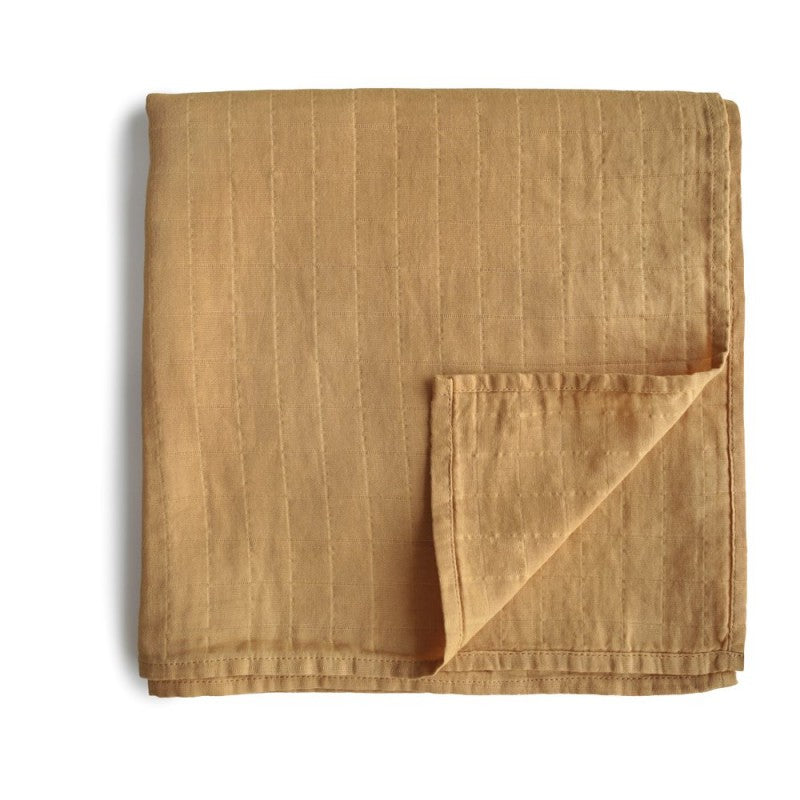 musselina swaddle para bebés e crianças na cor fall yellow da marca mushie