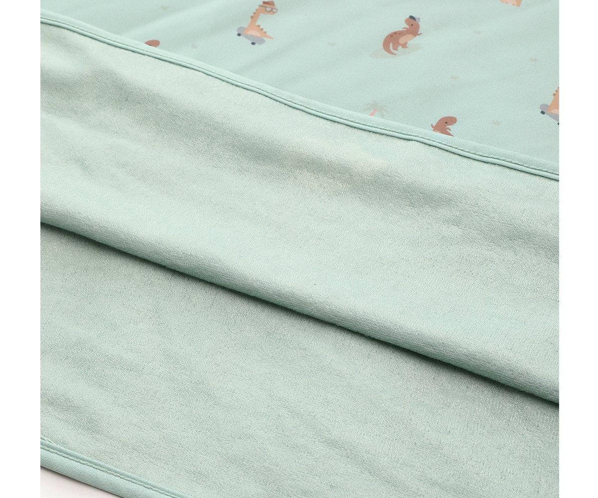 Poncho de praia infantil para bebés e crianças da marca Monneka no padrão cool dinos detalhe tecido